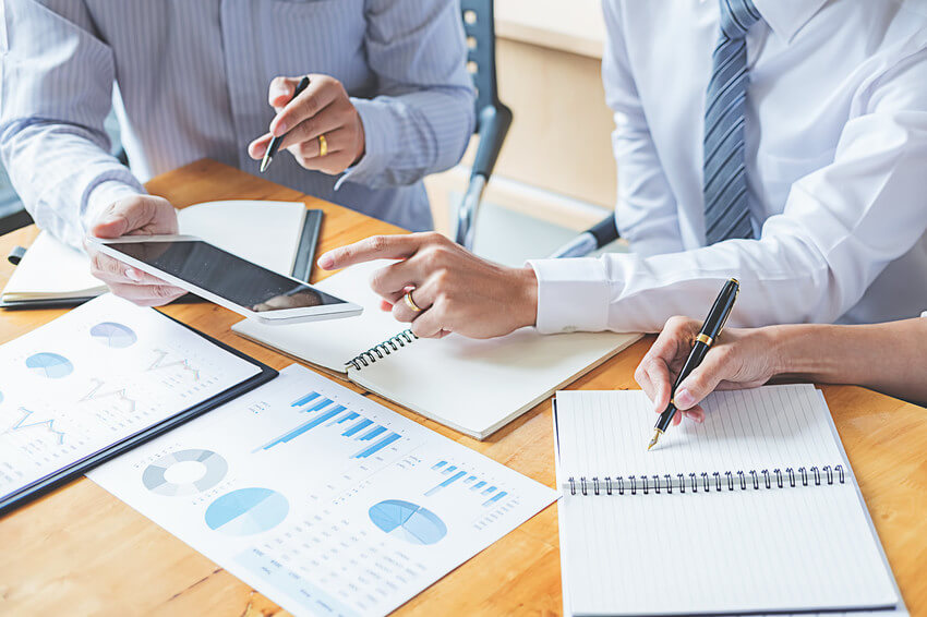 Business adviser analyzing financial figures denoting the progre